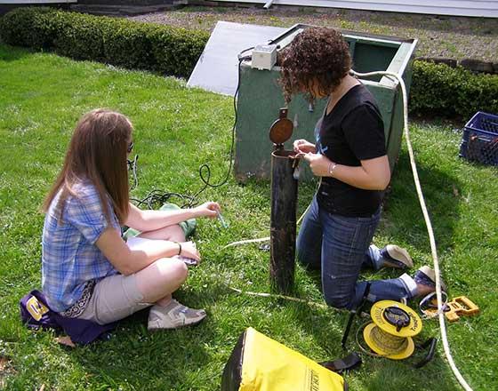 Two students doing Field Sampling Analysis